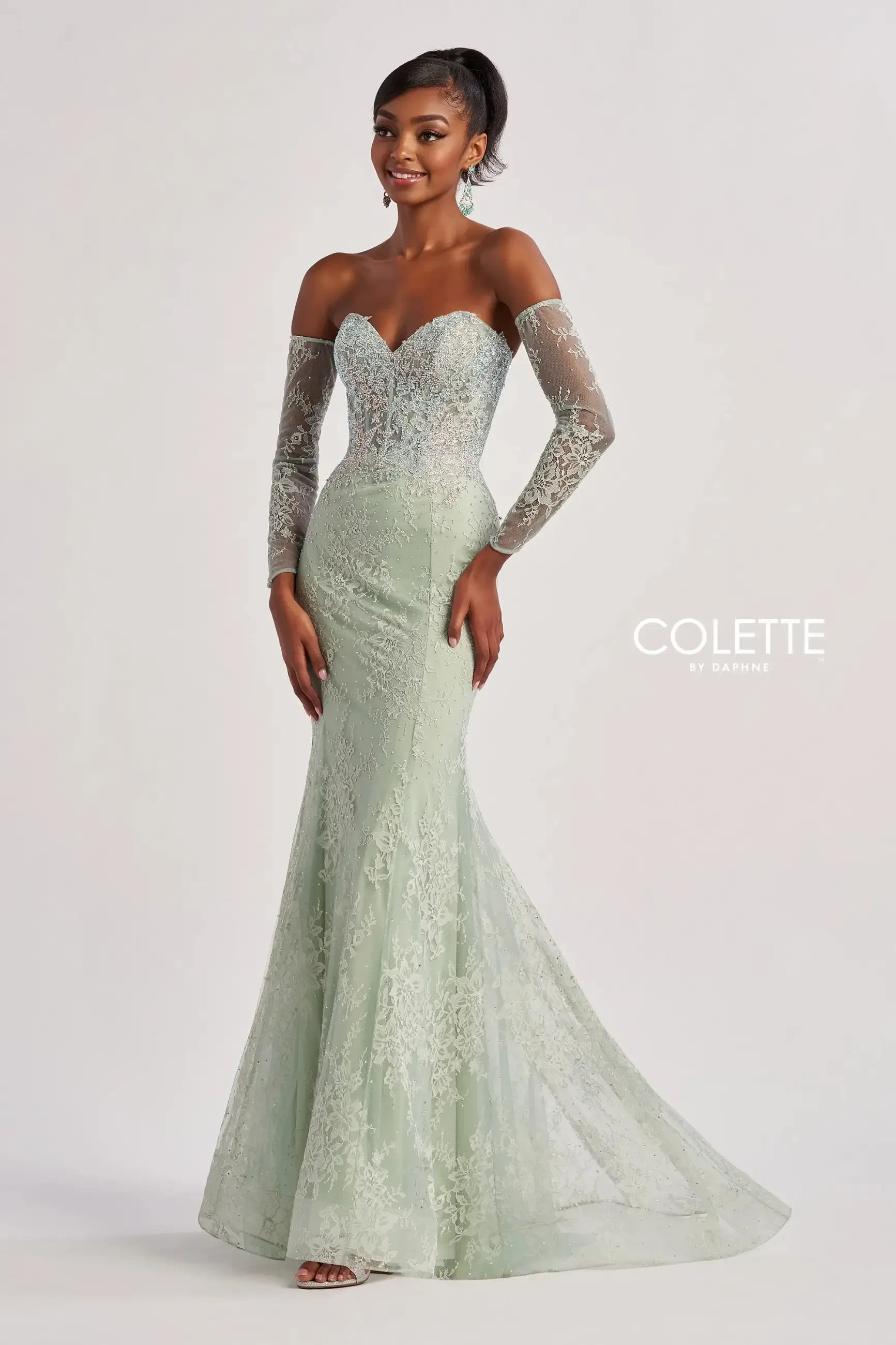model is wearing a sleek sage prom dress 