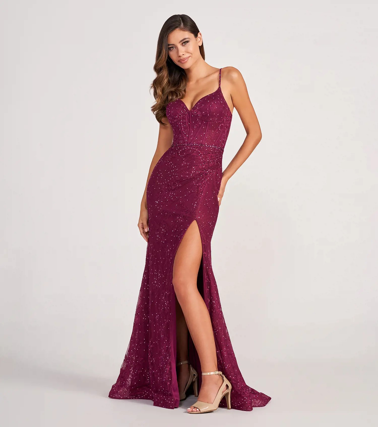 Model wearing lace prom dresses by Colette by Daphne