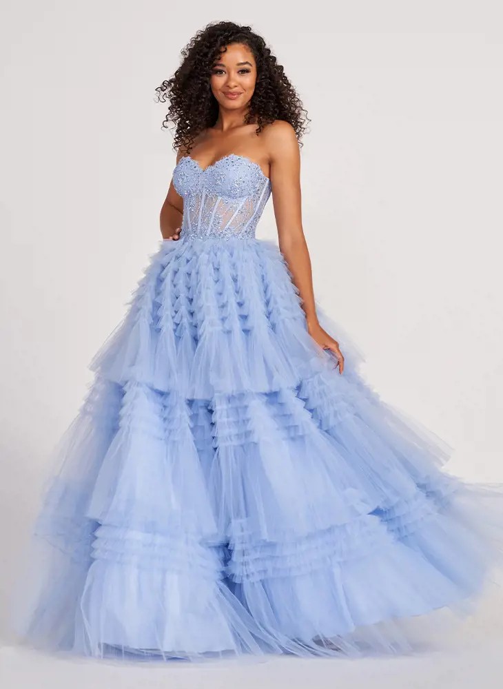 Model wearing long gray prom dress by Colette by Daphne